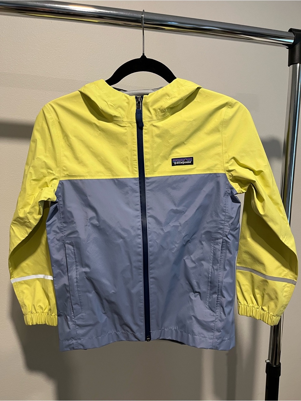 Patagonia kids' Torrentshell 3L hooded rain jacket.